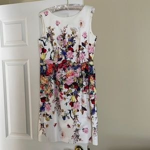 Sleeveless dress. 98%cotton 2%spandex. Worn once. Colorful floral design